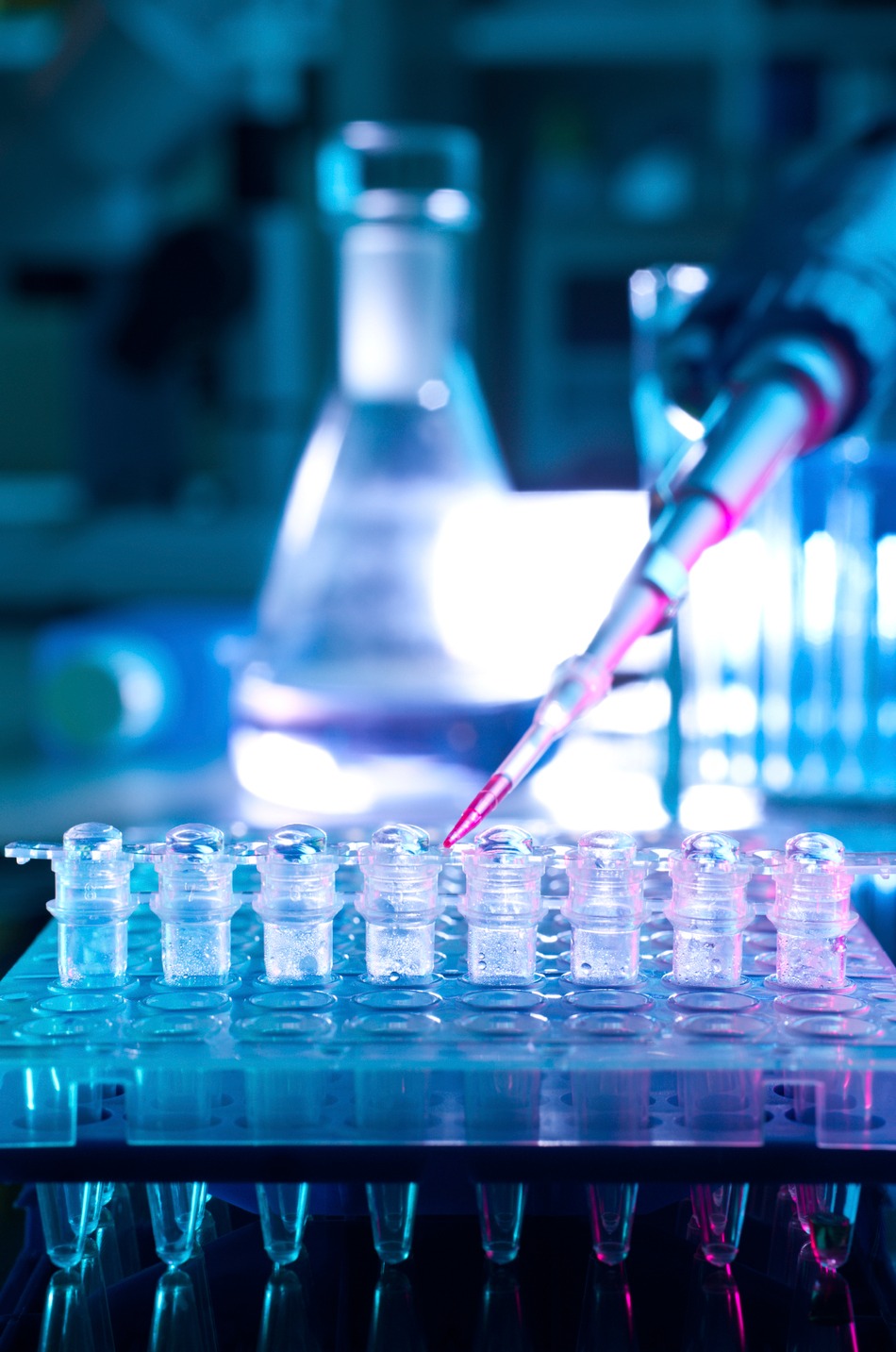 Scientist working with cell culture equipment in a laboratory
